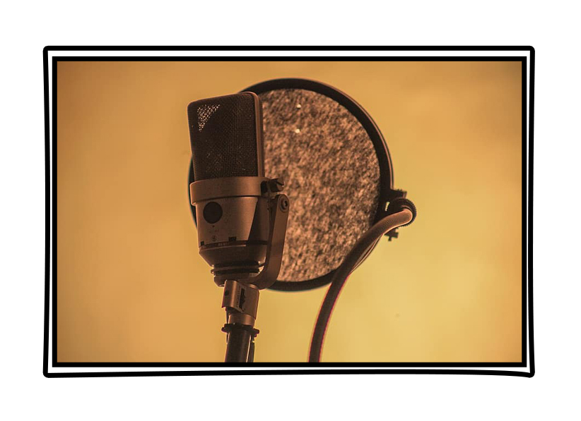 Studio recording microphone and pop shield on yellow background. Framed in comic book style window